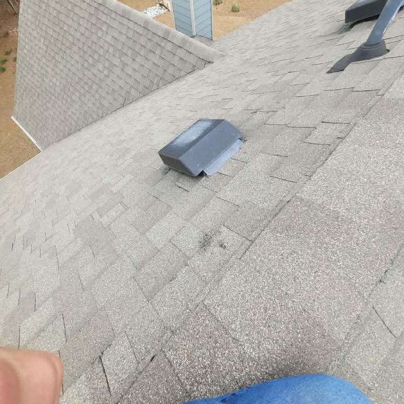 Roof shingles with vent flashing on residential roof