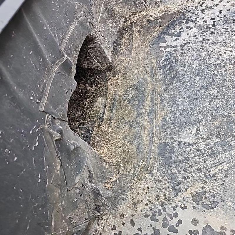 Flat roof membrane with large puncture hole Flat roof membrane with large puncture hole