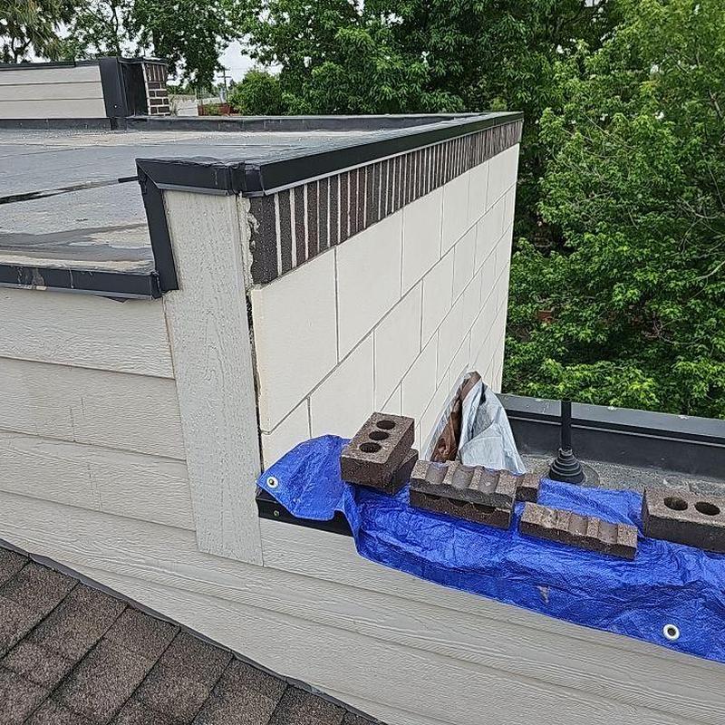 Flat roof patio with deteriorating seam protection Flat roof patio with deteriorating seam protection