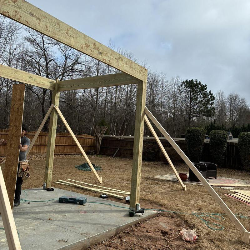 Gazebo wooden frame on concrete foundation with braces