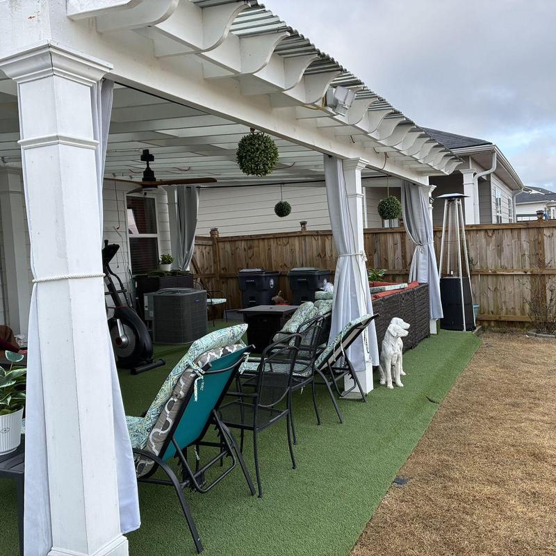 White pergola with translucent corrugated roof panels