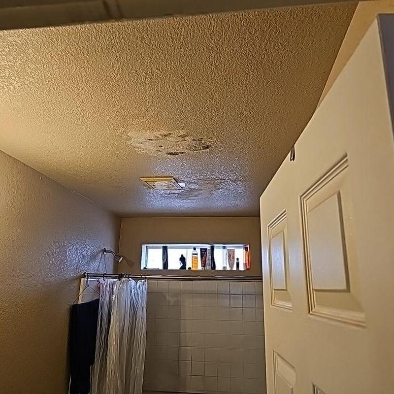 Bathroom ceiling with water damage and stains Bathroom ceiling with water damage and stains