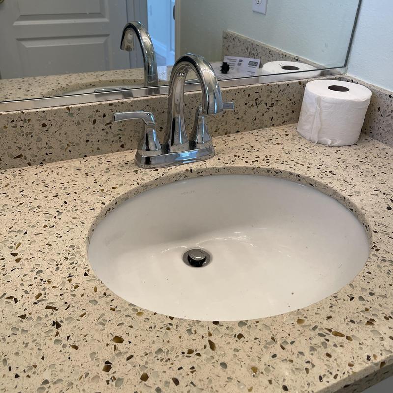 Bathroom faucet and pop-up drain installation on countertop
