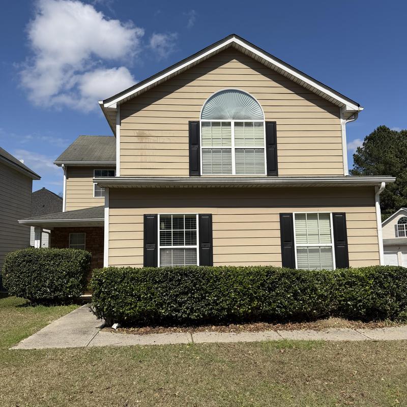 Fiber cement siding with loose panels needing replacement