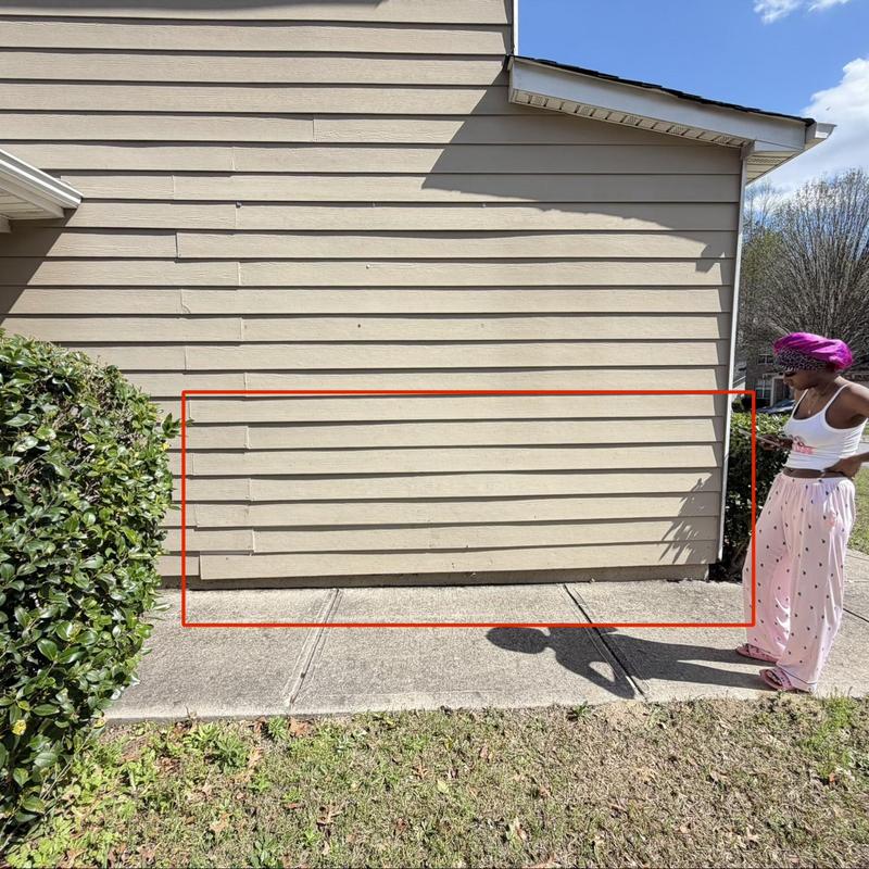 Fiber cement siding with loose boards marked in red
