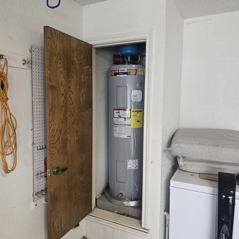 Water heater system with expansion tank in closet