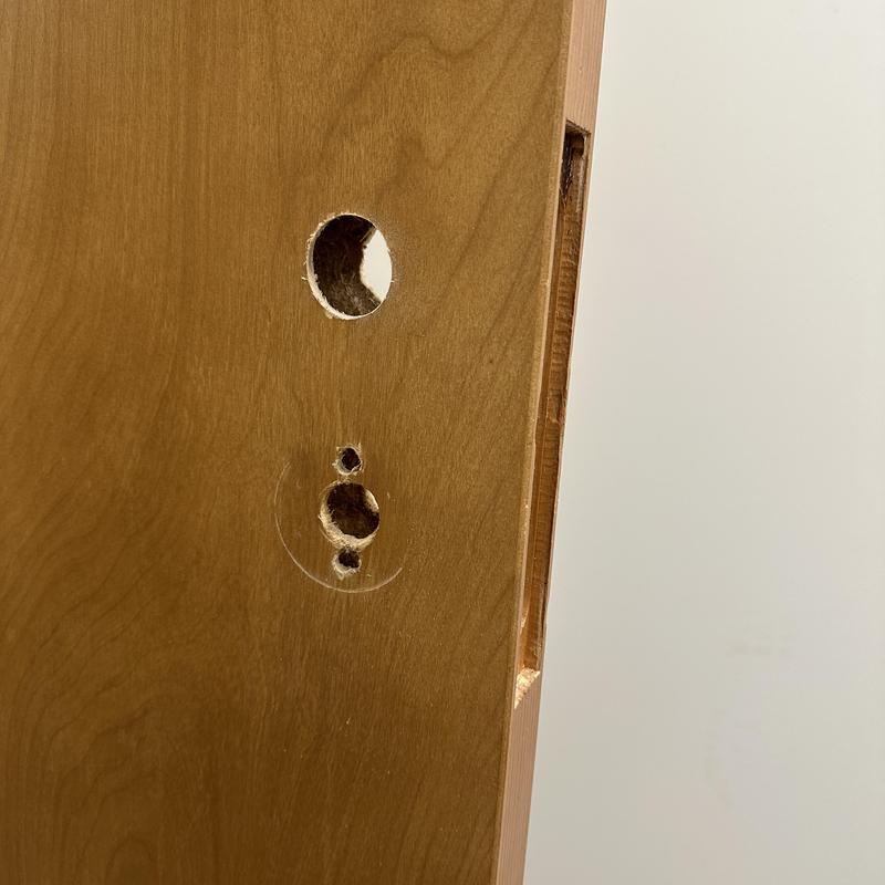 Mortice lock holes cut on wooden door edge