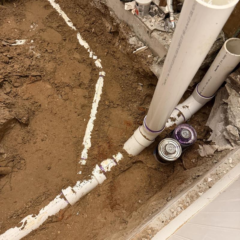 PVC sewer pipe re-pipe in slab home excavation