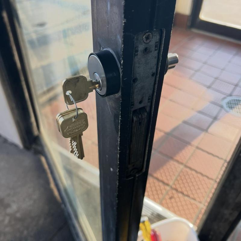 Glass door cylinder lock with keys inserted