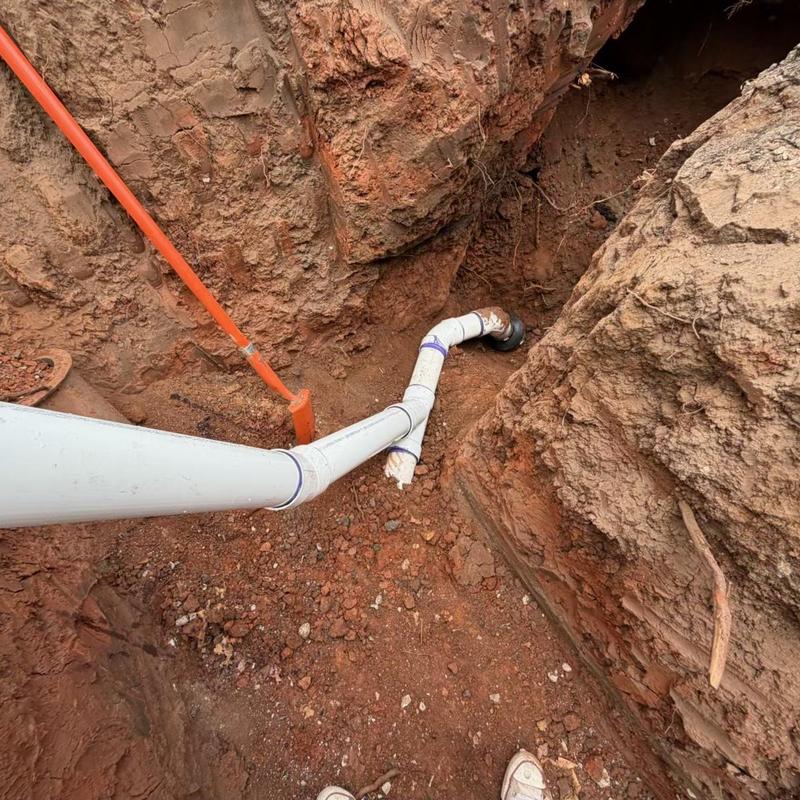 Sewer service line excavation and replacement in trench