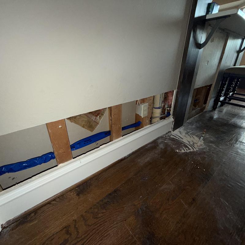 Slab leak reroute with exposed wall and floor protection