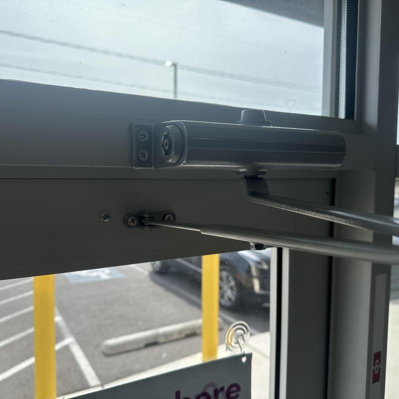 Automatic door closer installation on commercial door