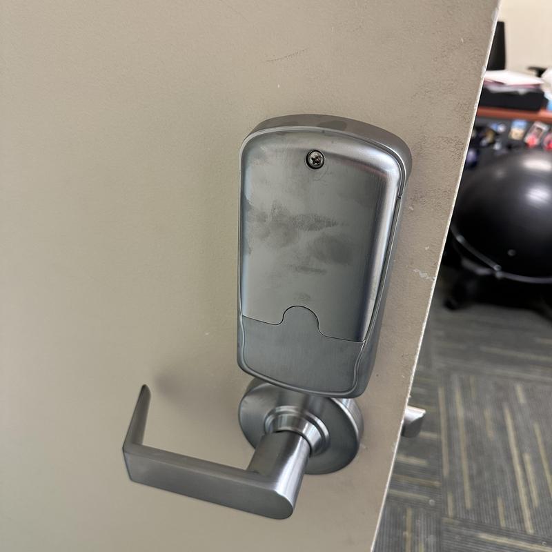 Keypad lock on commercial door with lever handle