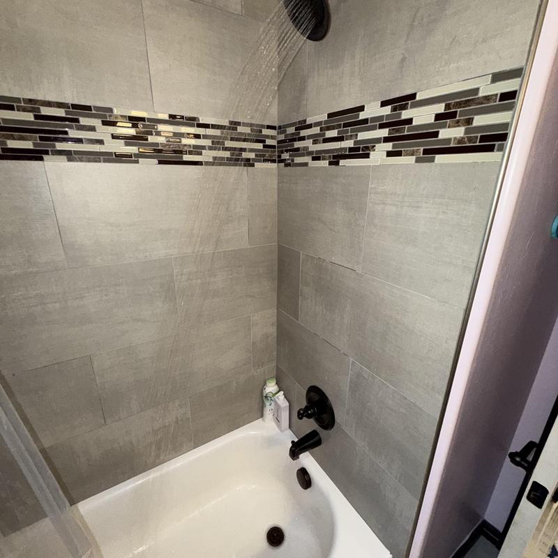 Shower diverter valve and tub spout in tiled shower