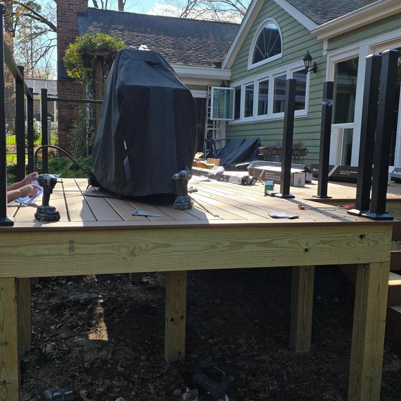 Deck framing with composite decking and metal posts