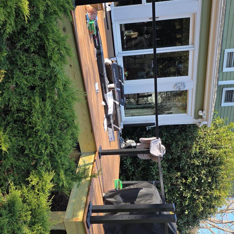 Deck framing with wooden beams and joists installation