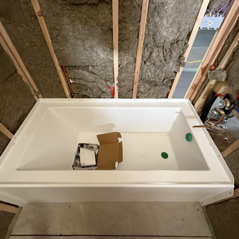 Bathtub installation in new construction bathroom framing