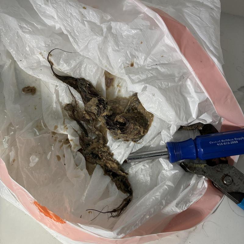 Bathroom sink drain hair clog removal with tools