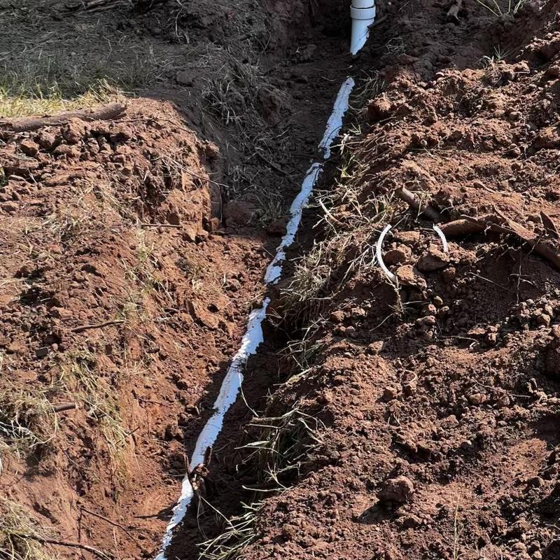 Sewer service line installation in excavated trench