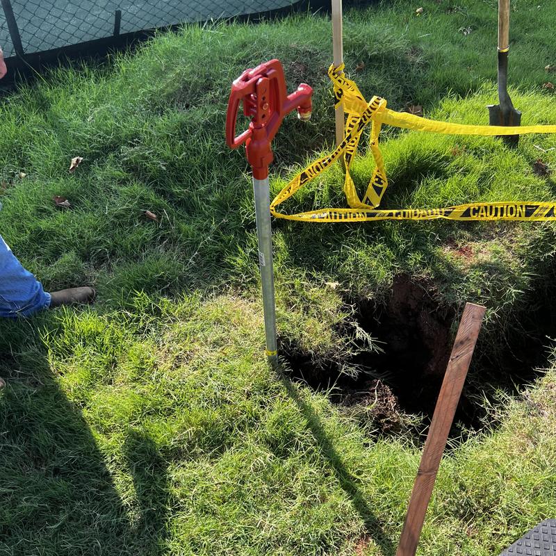 Yard bury hydrant installation in grassy yard