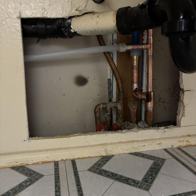 Cold water slab leak with exposed copper pipes