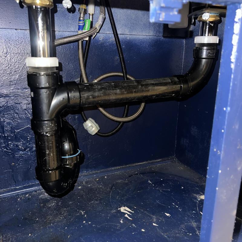 Kitchen sink drain plumbing with new P-trap installed