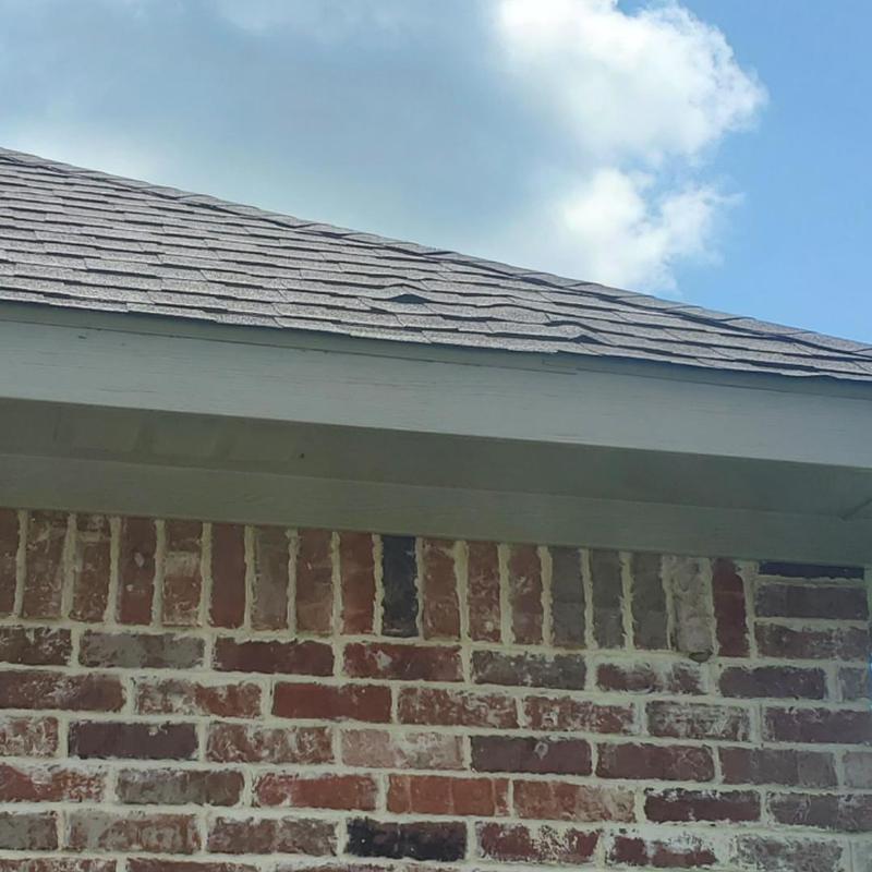 Asphalt shingle roof with wind and hail damage