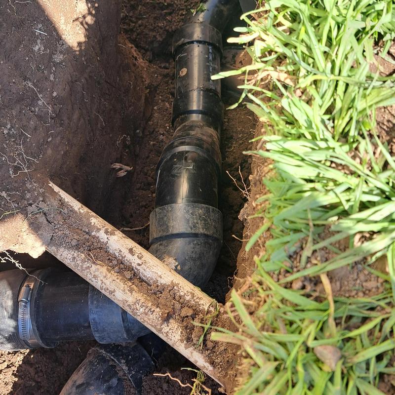 Sewer ejector pump piping trench in yard