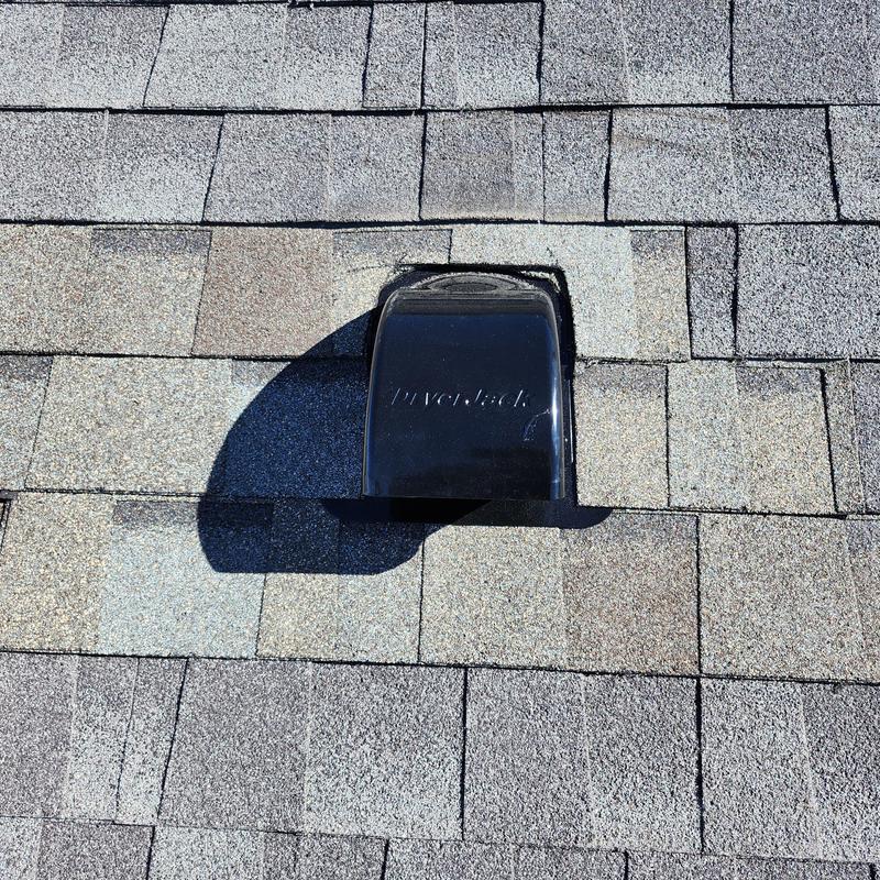 Dryer vent with new flapper installed on shingle roof