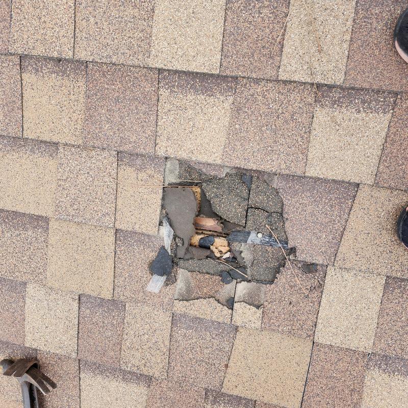 GAF 30 yr Shakewood damaged shingles with hole