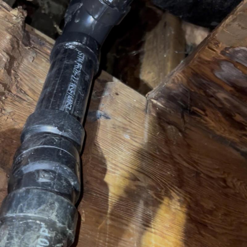 ABS tub waste and overflow pipe installation in floor joist