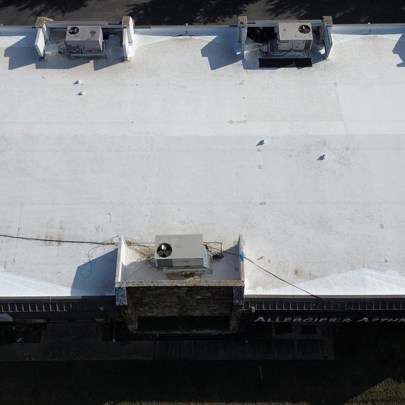 TPO membrane roof with HVAC units on commercial building