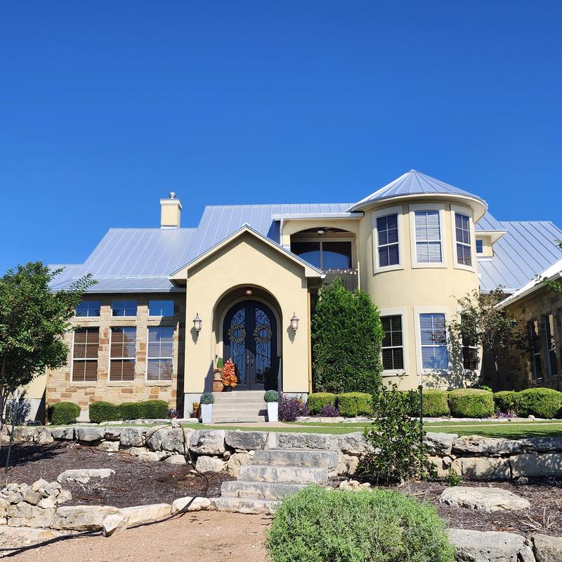 1.5 Standing seam metal roof with chimney covers and gutters 1.5 Standing seam metal roof with chimney covers and gutters