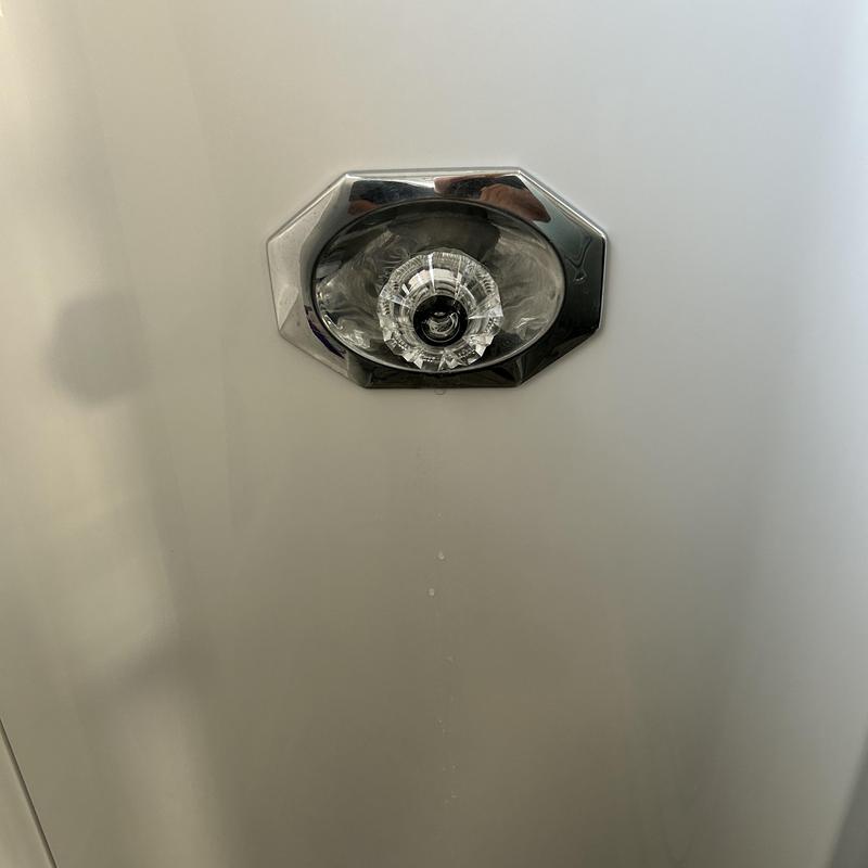 Shower valve handle and trim assembly on fiberglass wall