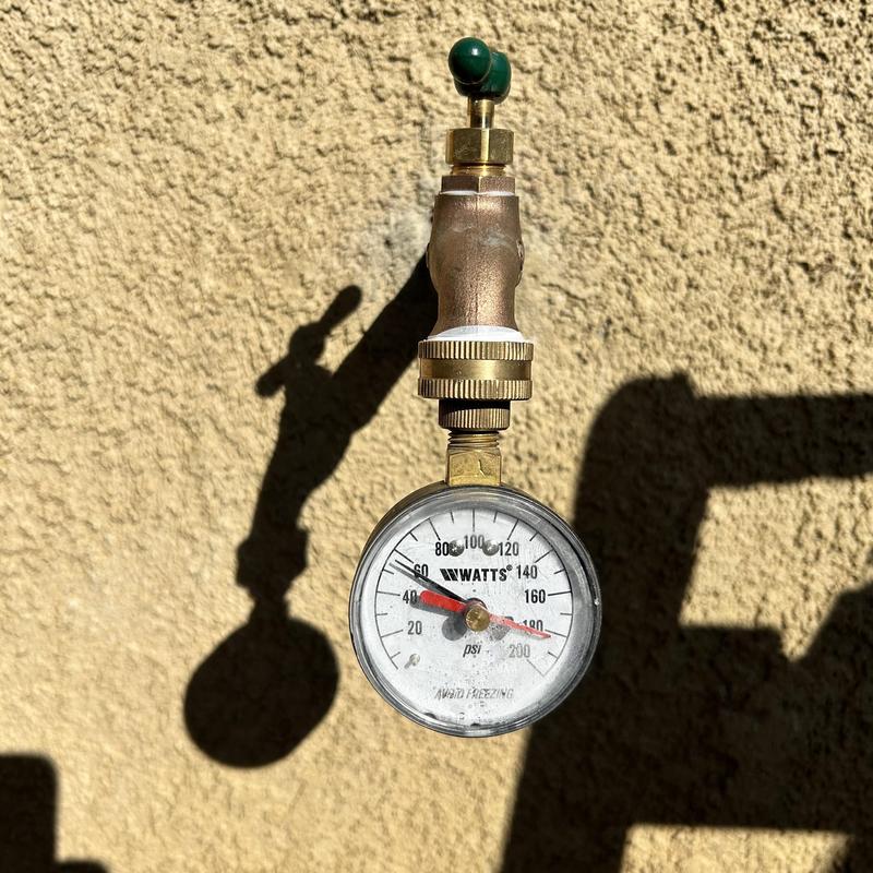 Pressure gauge on outdoor water valve reading 44 psi