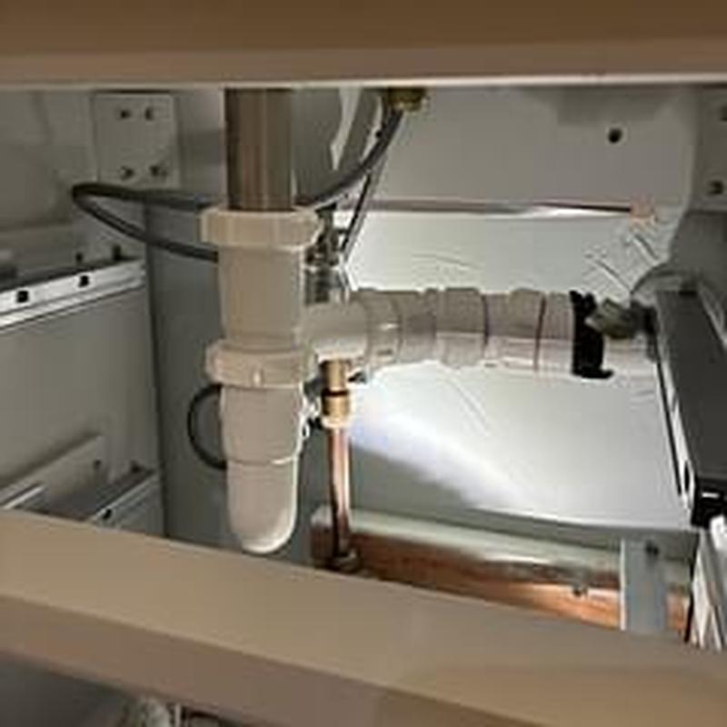P-trap under sink with new pipe fittings installed