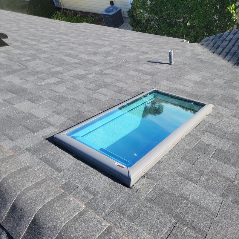 Skylight installation on Owens Corning asphalt shingle roof