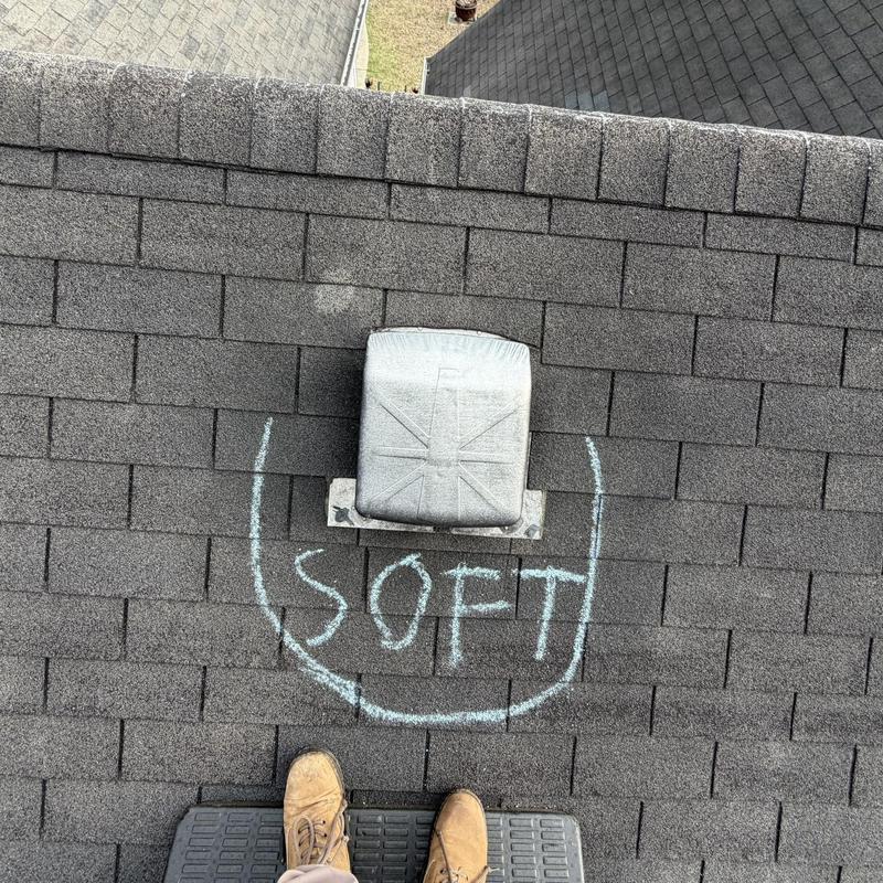 Roof shingles with soft spot marked near box vent