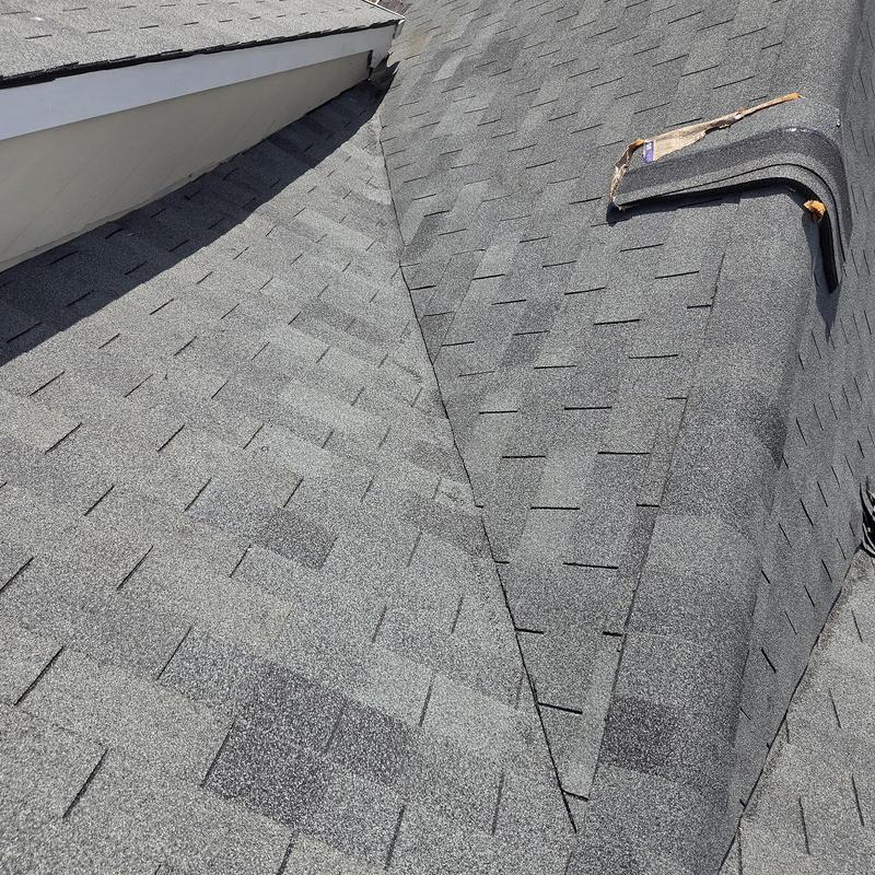 Roof valley with new flashing and sealed shingles