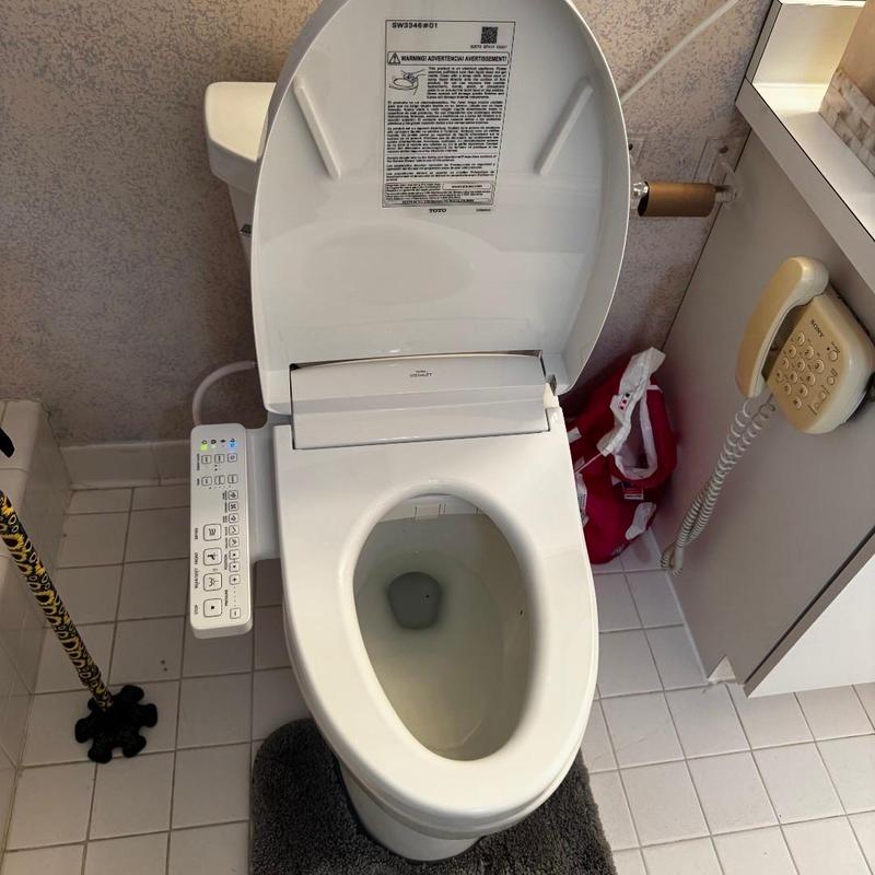 Toto bidet seat installation on toilet bowl