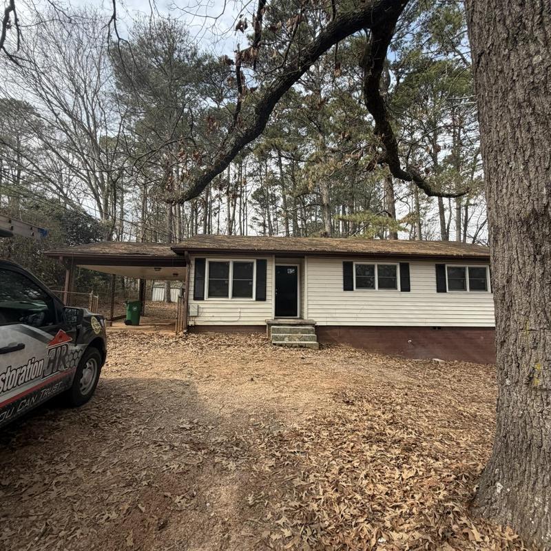Roof decking and rafters with damaged gutters and fascia