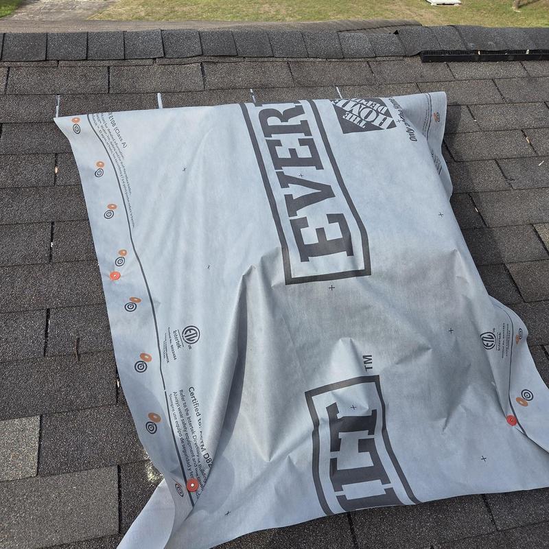 Roof decking underlayment installed on shingled roof