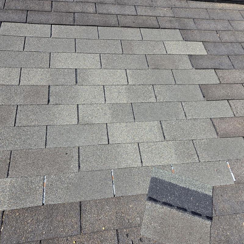 Roof shingles replacement and decking repair on roof surface