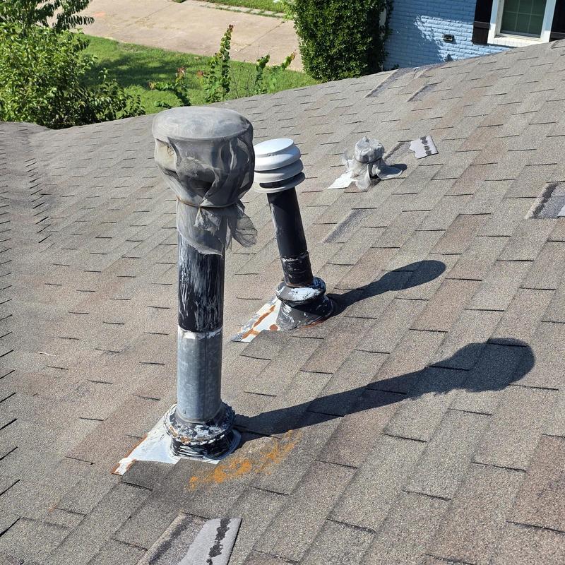 Roof vent pipes with protective mesh on shingles