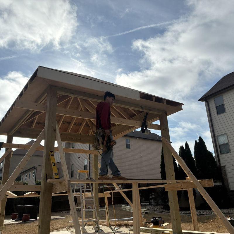 Screened enclosure framing with worker and tools