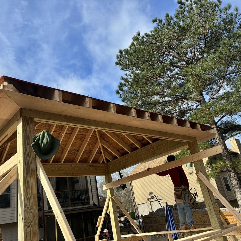 Screened enclosure frame construction with wood roof beams