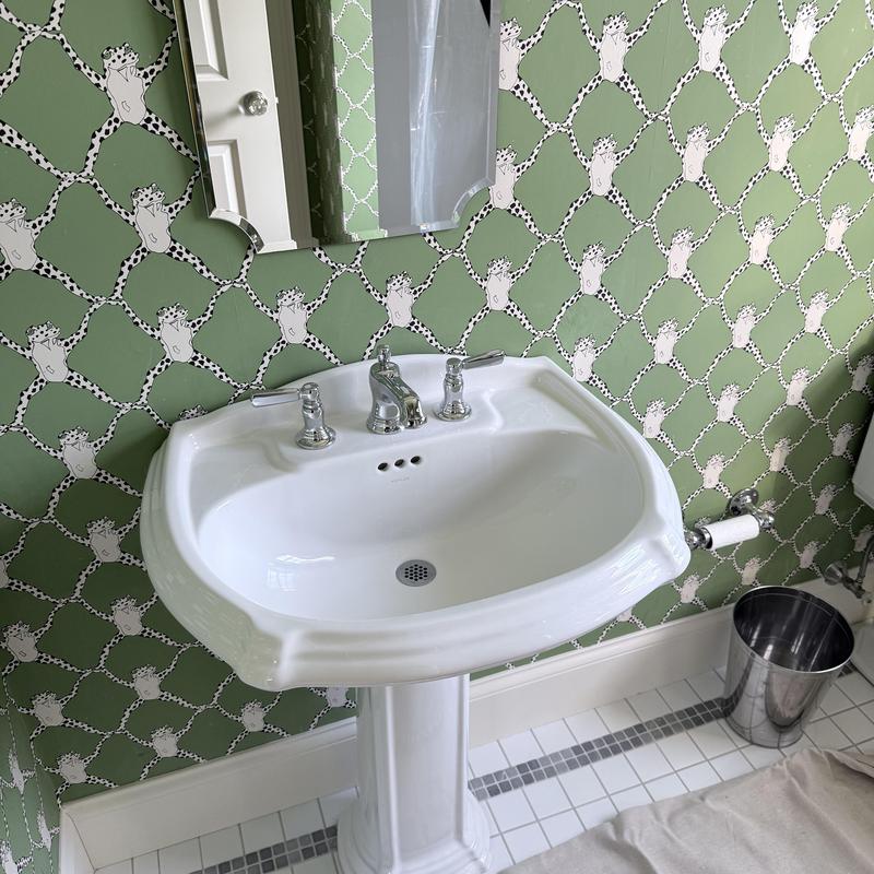 Pedestal sink with new faucet installation in bathroom Pedestal sink with new faucet installation in bathroom