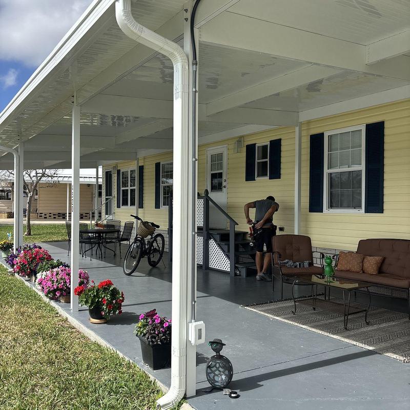 Vinyl siding and custom pergola on front porch