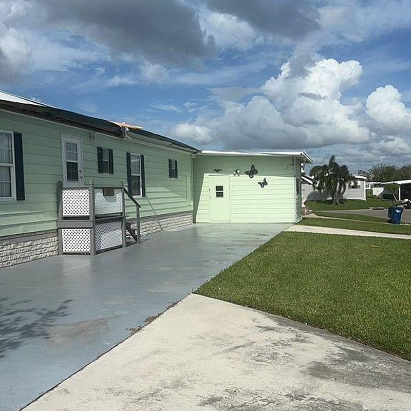 Vinyl siding with attached ramp on residential home exterior