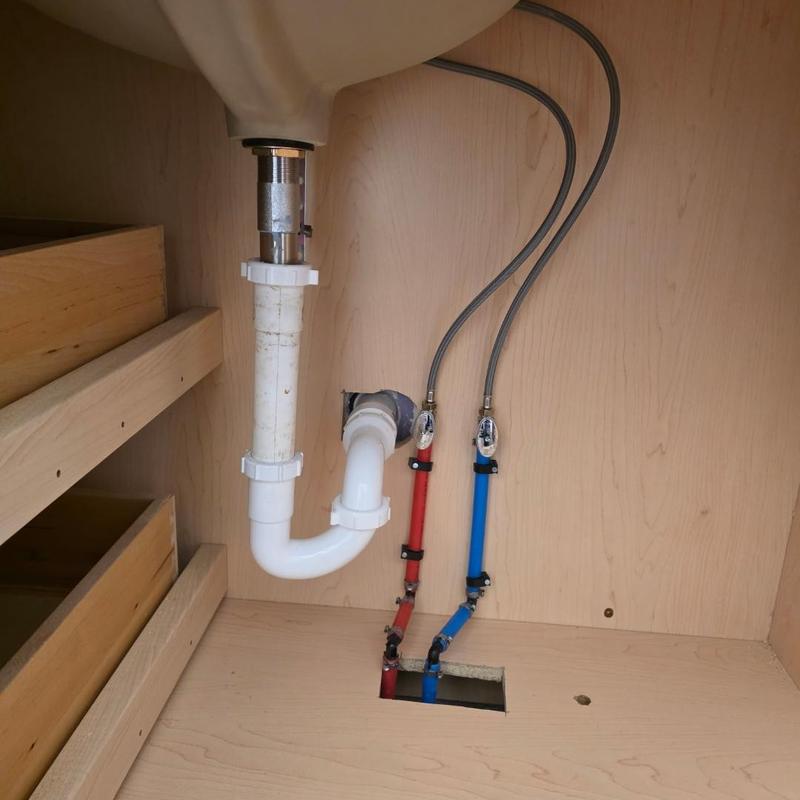 Vanity faucet water lines and drain installation under sink
